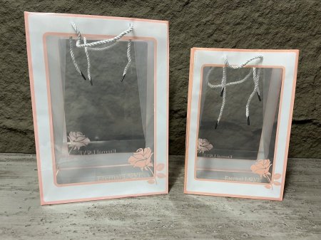 كيس هدايا بلاستك مقوى شفاف لون زهري مع وردة 