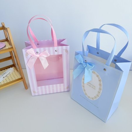 كيس هدايا كرتون وجه شفاف ازرق وزهري